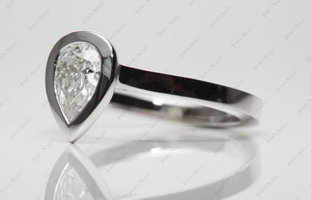 bezel set pear shaped diamond ring
