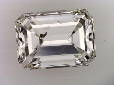 very obvious inclusion under table facet of emerald cut diamond