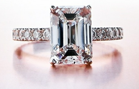 melee pave diamond with main emerald cut diamond