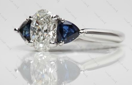 oval cut diamond with sapphire trillion cut gemstone