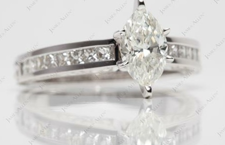 princess cut diamonds in channel set ring with main centre stone of marquise