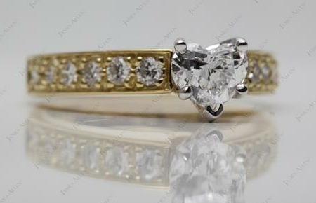 yellow gold setting with round diamonds for heart shaped diamond