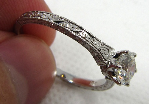 solitaire antique engagement ring with engraved sides