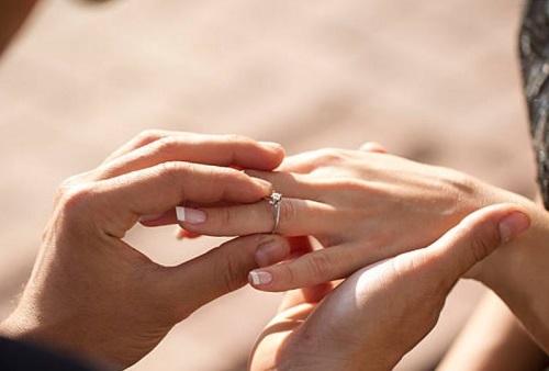 half a carat diamond ring proposal worn on left finger
