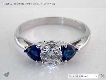 trillion sidestone blue sapphire with center diamond trilogy
