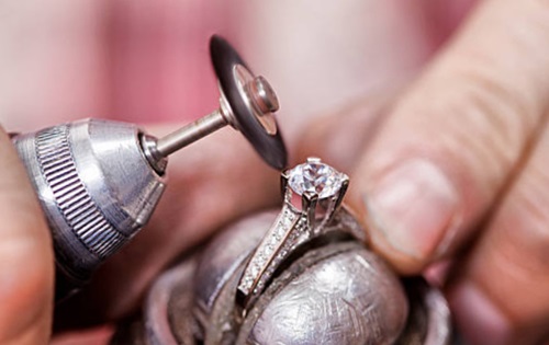 jeweler making a ring in workshop