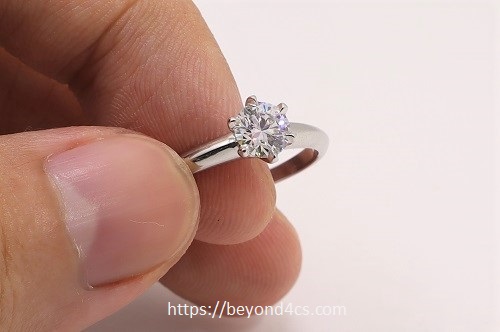 upclose inspection of 6 prong vvs1 engagement ring