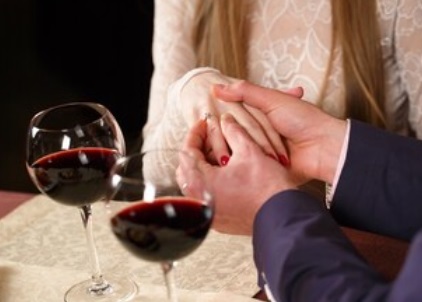 proposing in a restaurant to a loved one wine