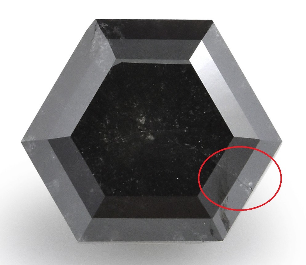 black diamond with large fracture across girdle and table facet