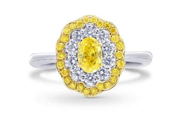 floral yellow oval diamond ring encased in white and yellow diamond halo